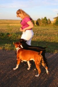 Leah walking two dogs